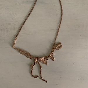 Gold dinosaur necklace